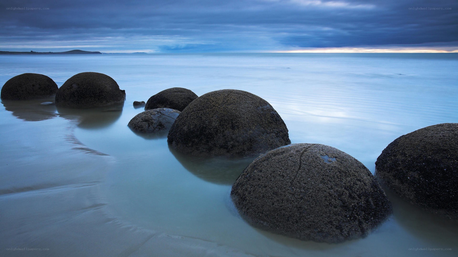 Boulders on a calm beach