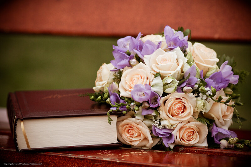 Bouquet and book on table