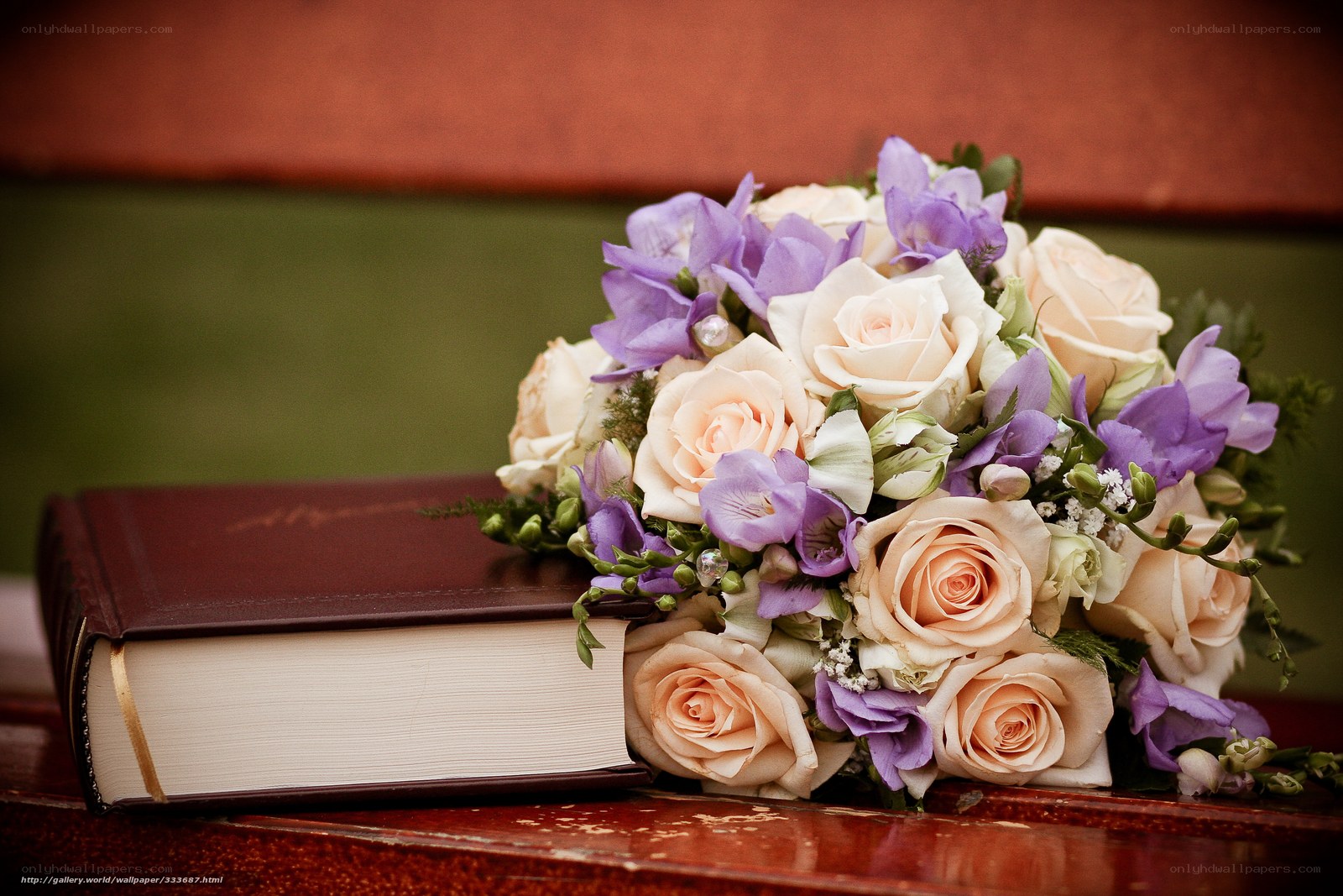 Bouquet and book on table