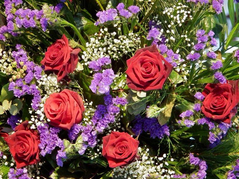 bouquet of red roses and purple flowers