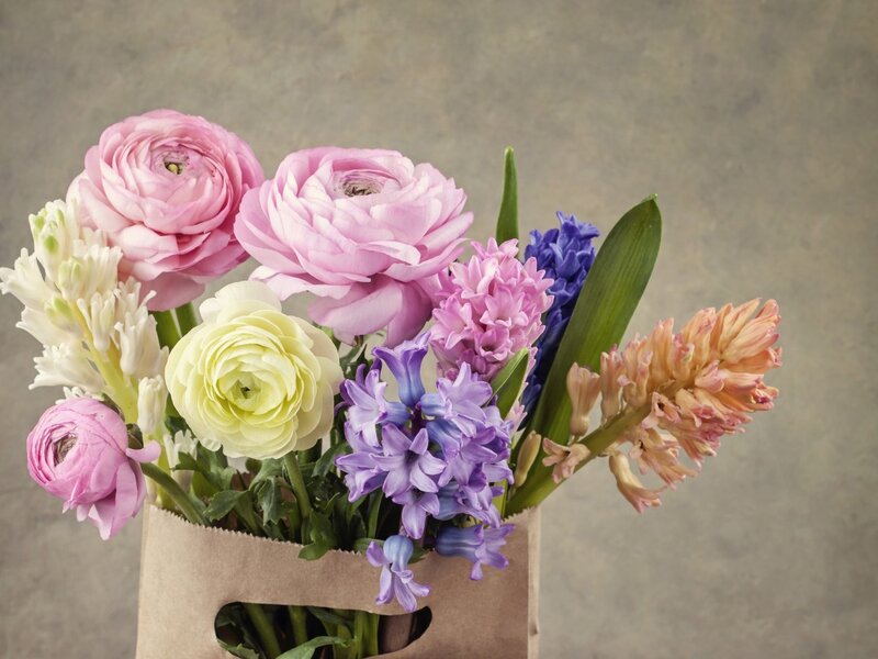Bouquet of Spring Flowers — Pink, Calm, Photograph, Paper Bag, Green Leaves