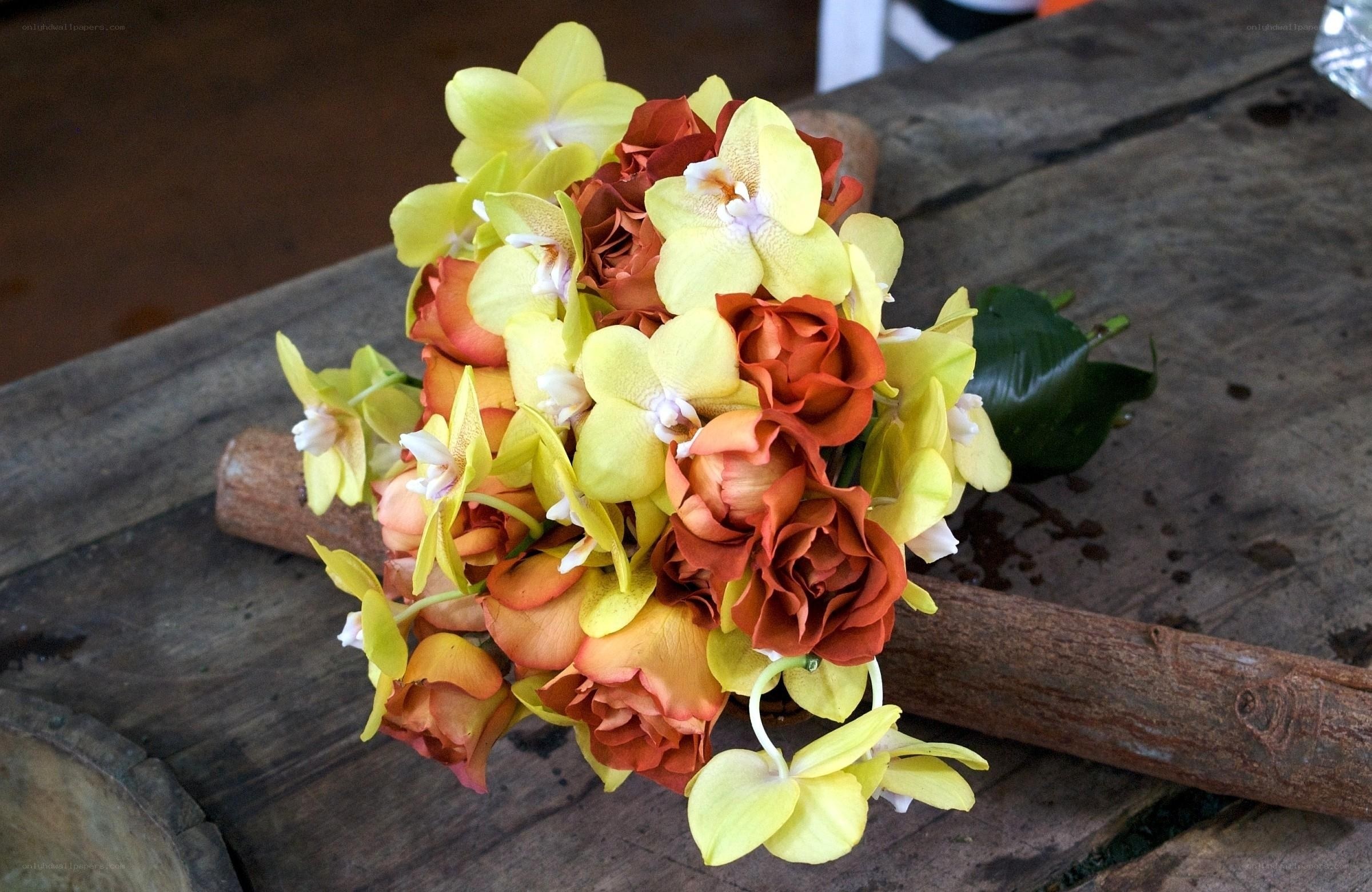 Bouquet of yellow orchids and roses