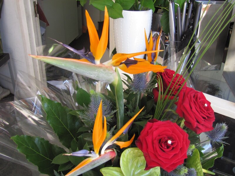 Bouquet with birds of paradise and roses