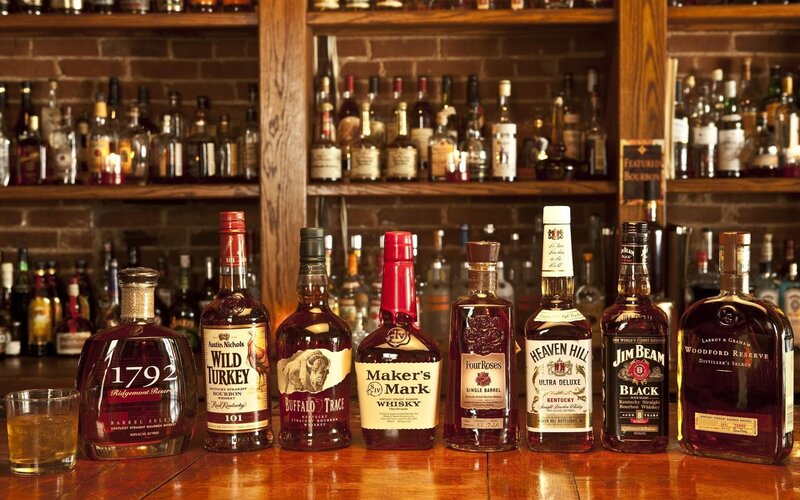 Bourbon bottles on bar counter