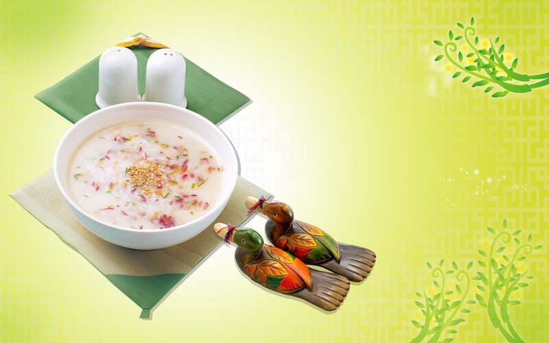 Bowl of congee with duck figurines