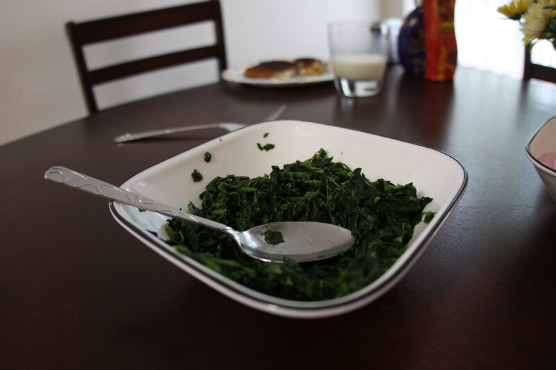bowl of cooked spinach on table