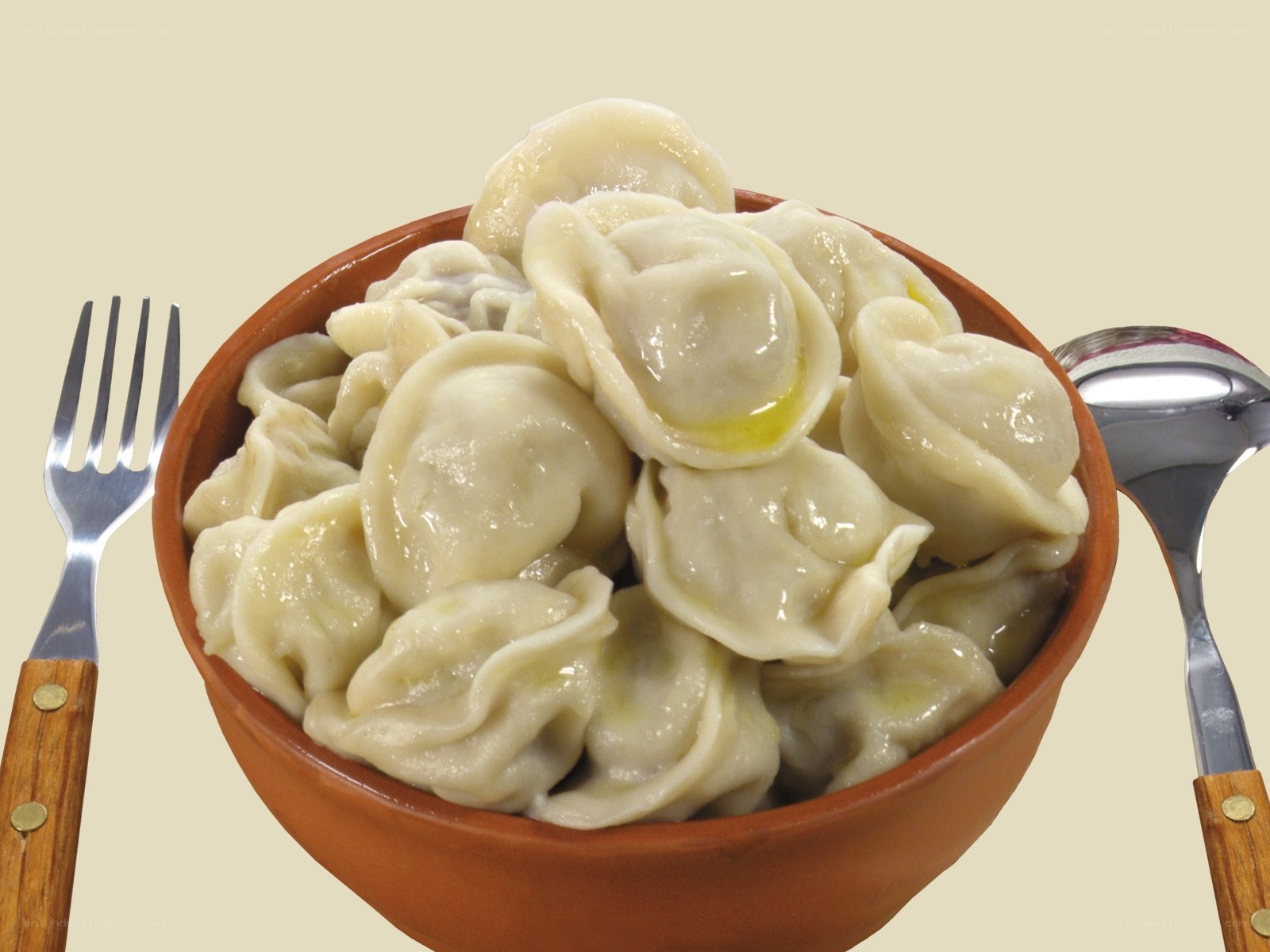 Bowl of dumplings with utensils