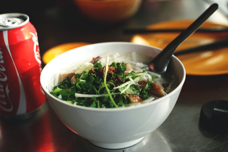 Bowl of pho with soda