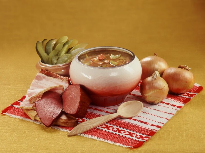 Bowl of soup with meats and onions