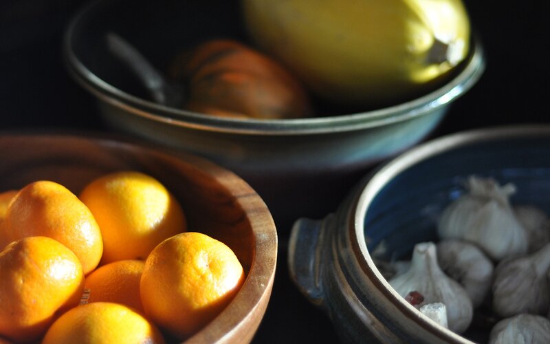 bowls of fruit and garlic
