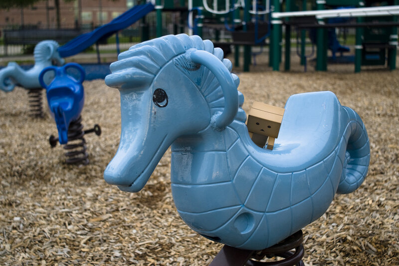 Box character on seahorse ride