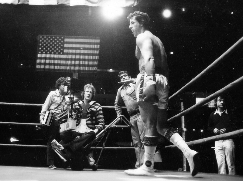 Boxer in ring with crew