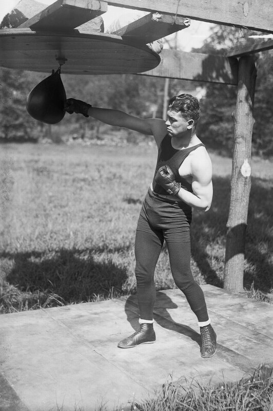 Boxer training with a speed bag
