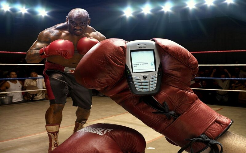 Boxer with phone in ring