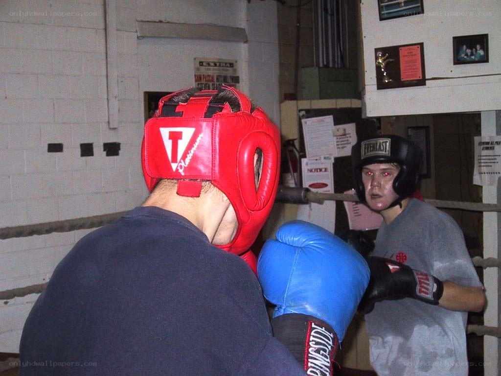 Boxers sparring in a gym