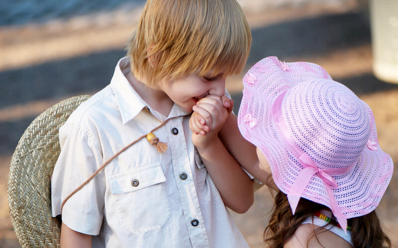 Boy and Girl Holding Hands — White