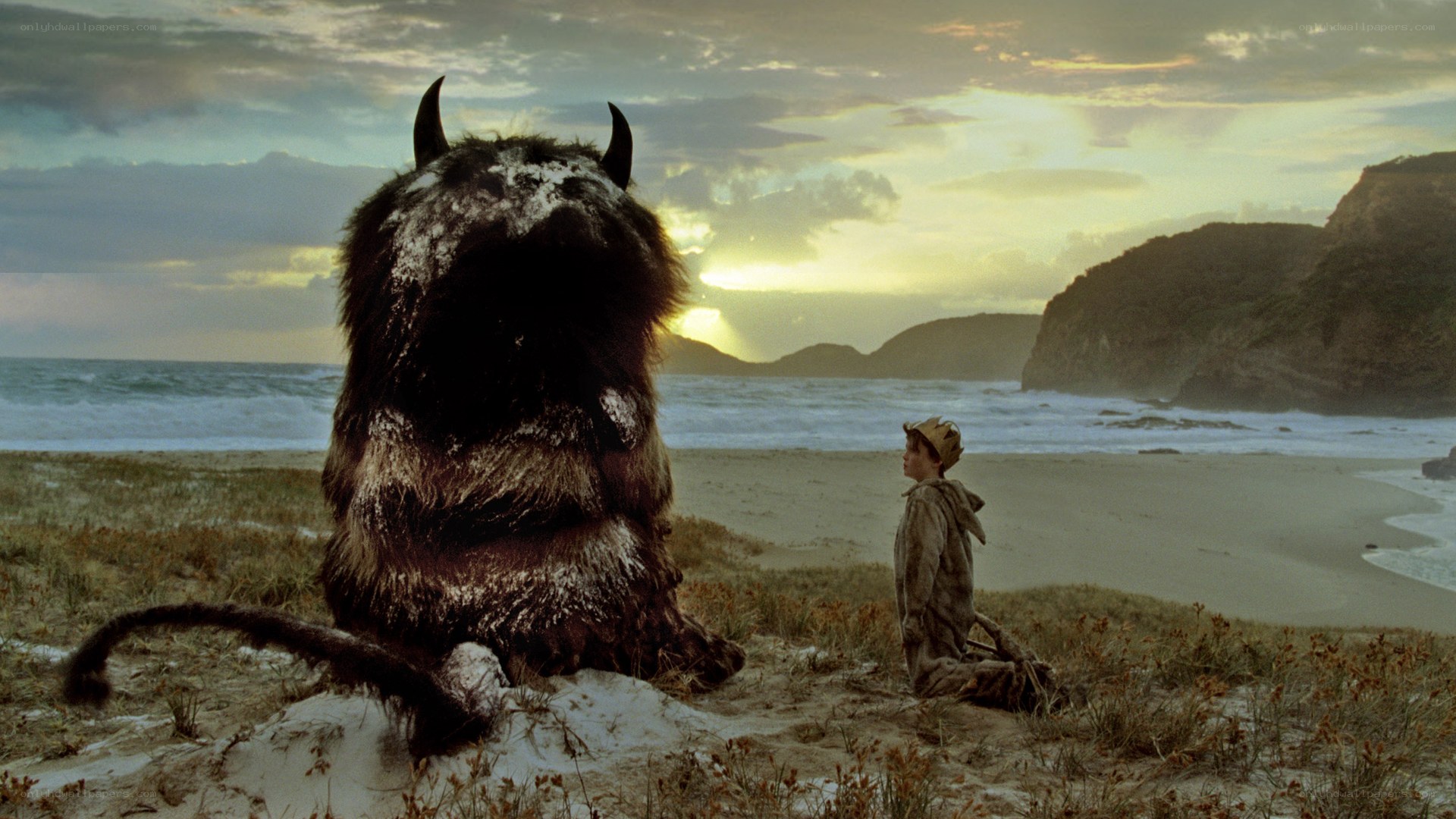 Boy and monster on a beach