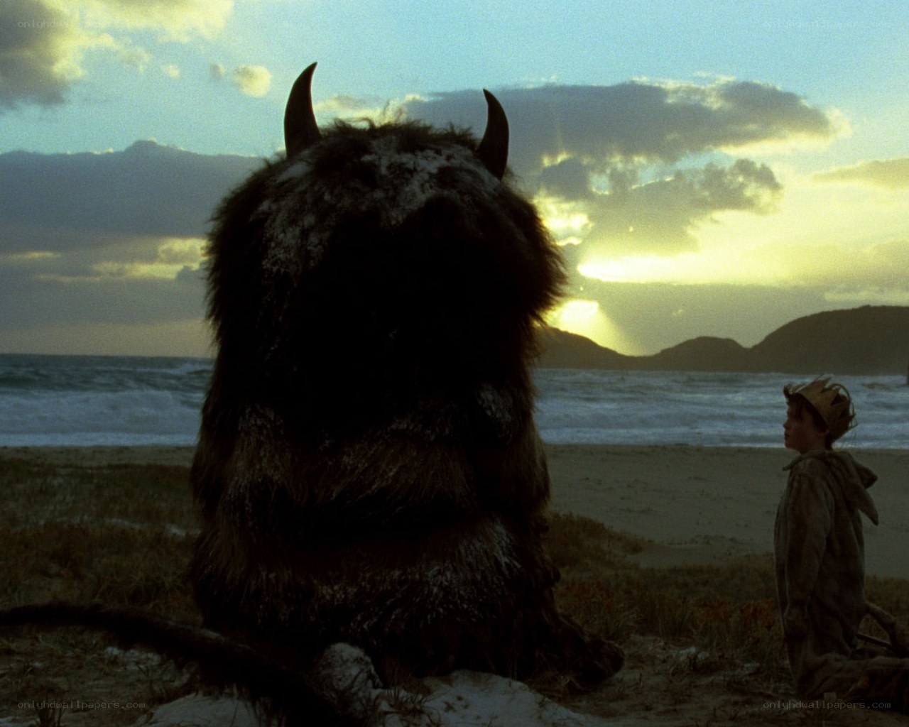 Boy and monster on a beach