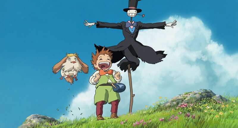 boy and scarecrow in a field