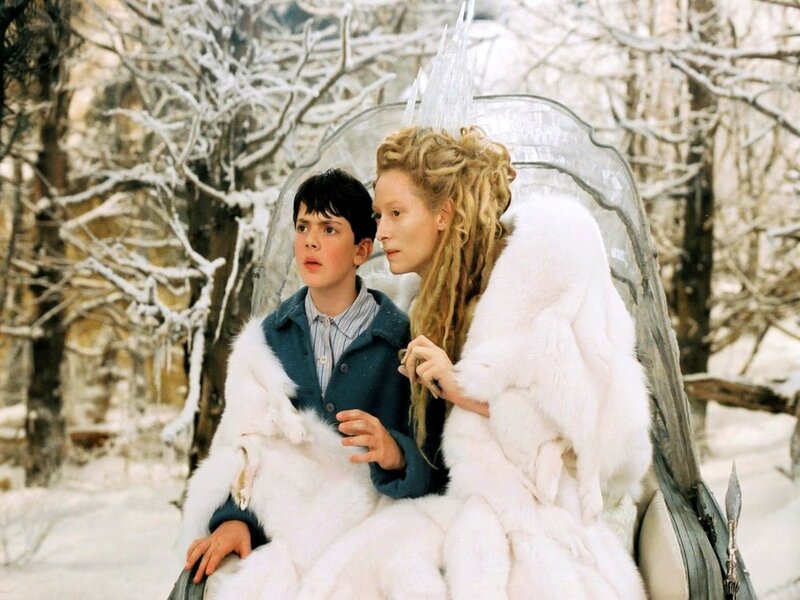 boy and woman in snowy forest