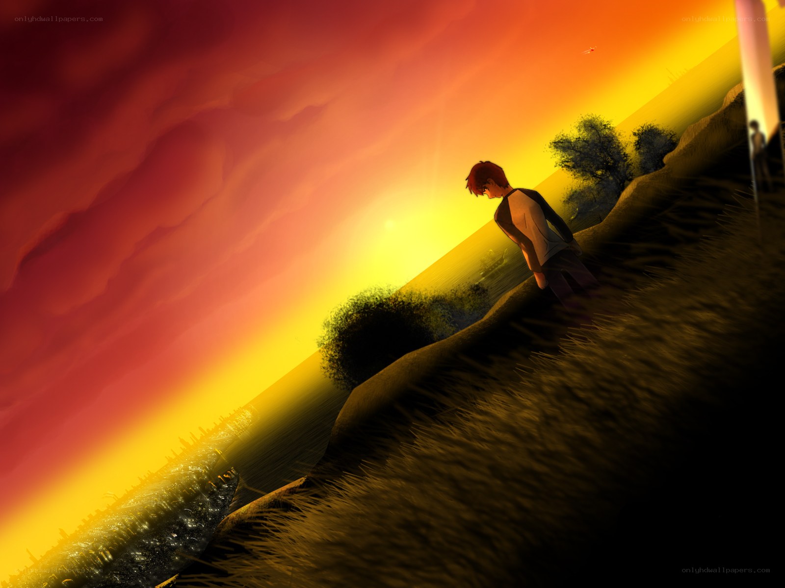 Boy at sunset on a hill