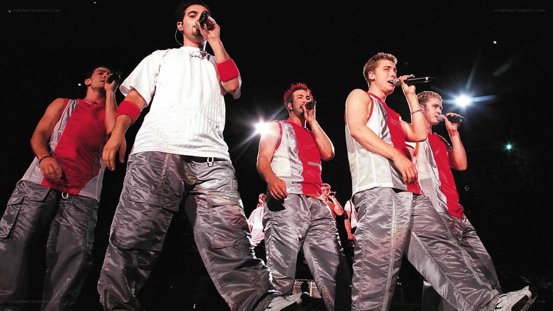 boy band performing on stage