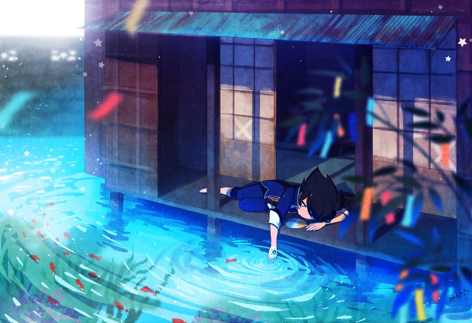 boy by the water at night