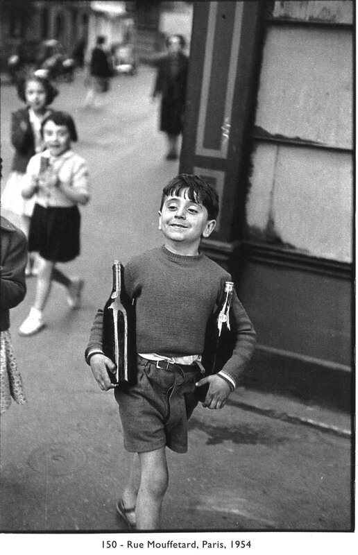 Boy carrying bottles on street