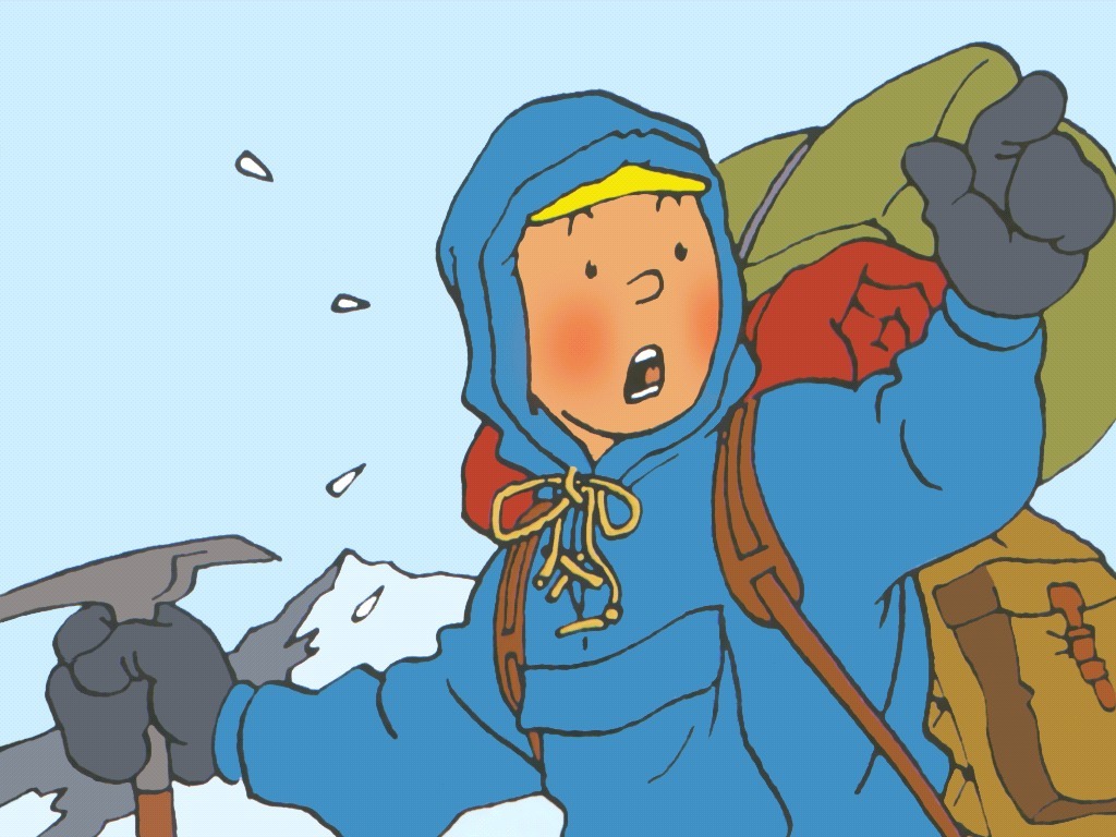 Boy climbing a snowy mountain