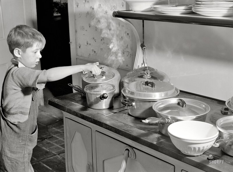 Boy cooking in kitchen