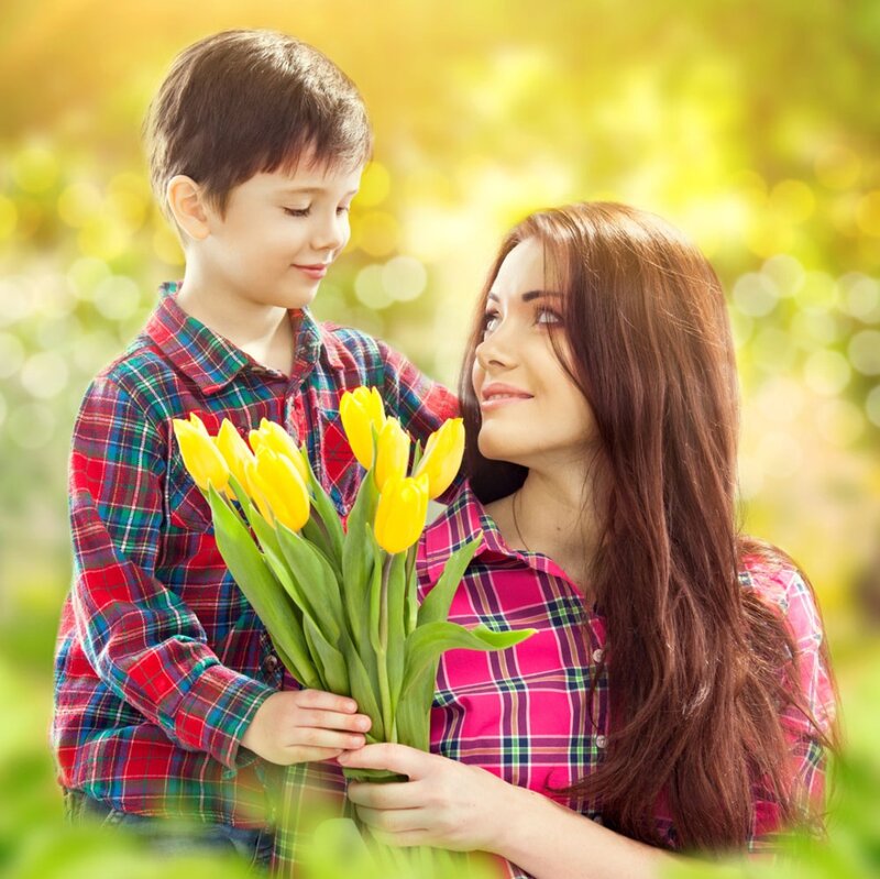 Boy Giving Flowers to Woman