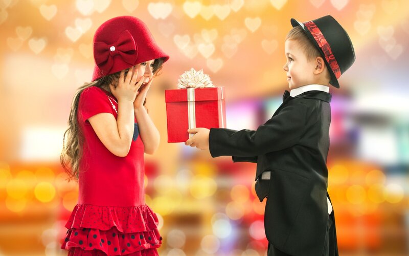 Boy Giving Gift to Girl
