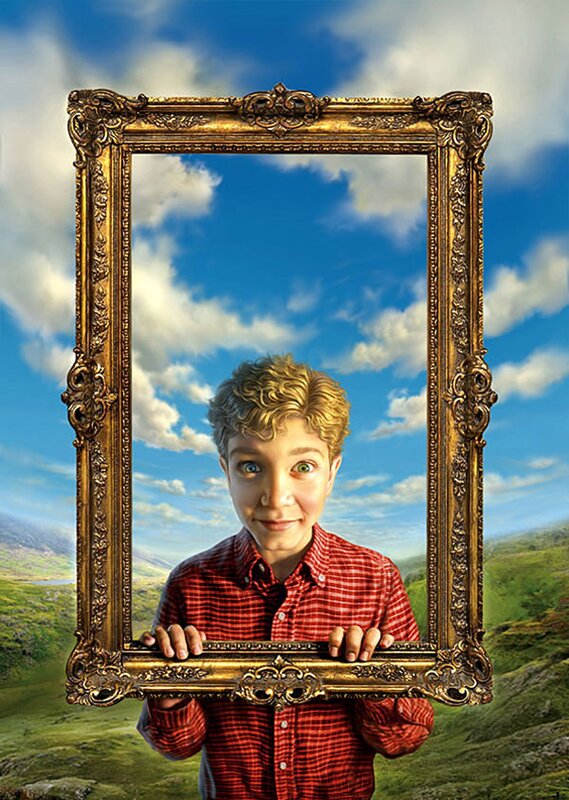 boy holding a picture frame