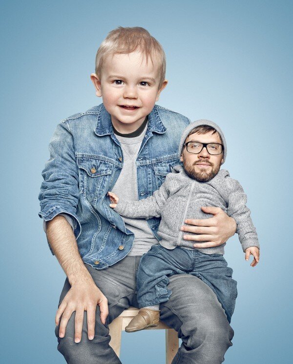 boy holding a small man