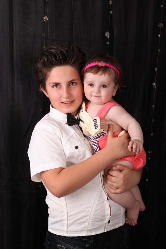 boy holding baby girl