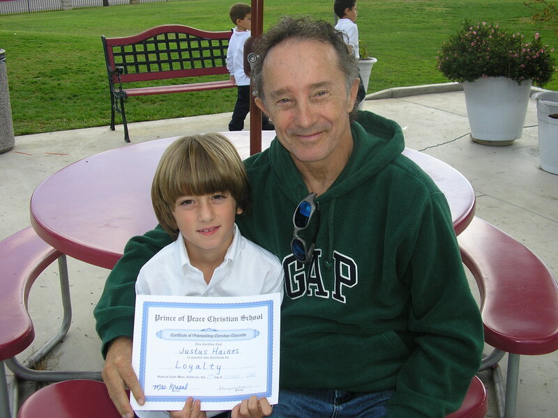 Boy Holding Certificate