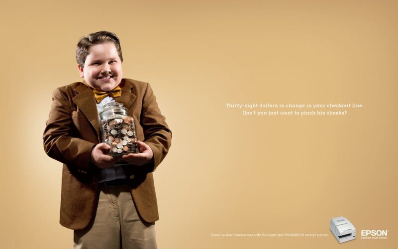 boy holding jar of coins