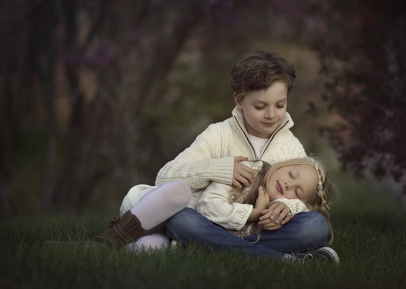 Boy Holding Sleeping Girl