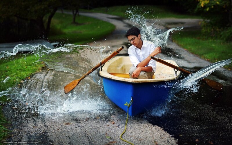 Boy in a boat on a path