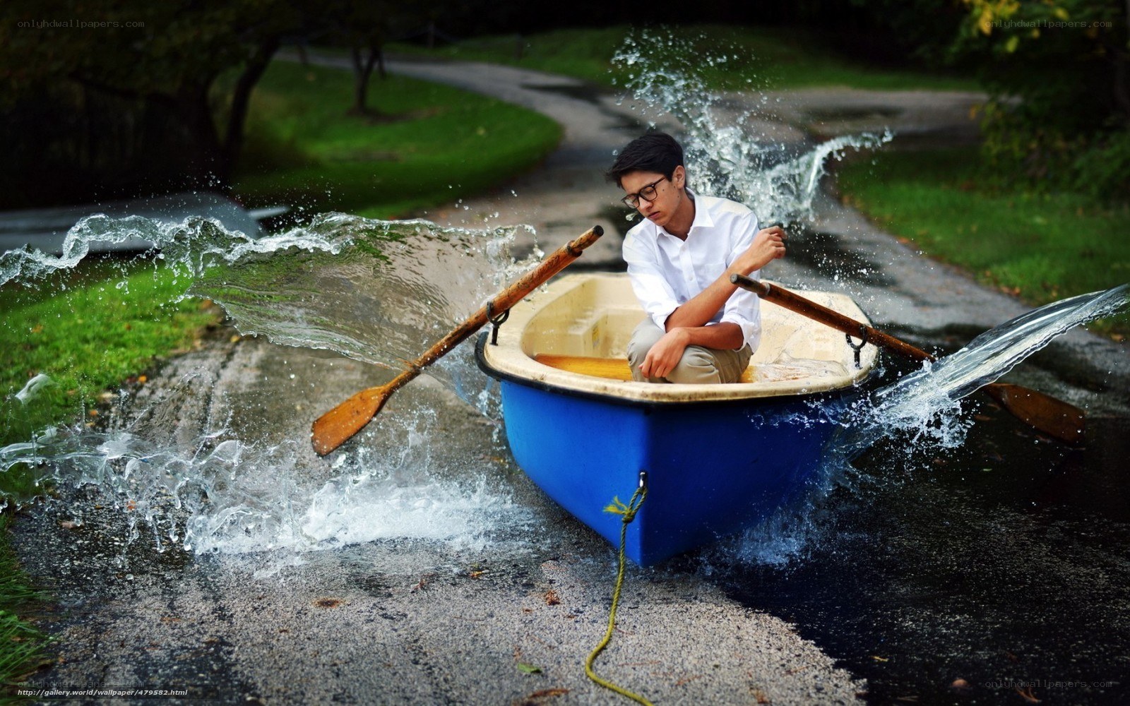 Boy in a boat on a path