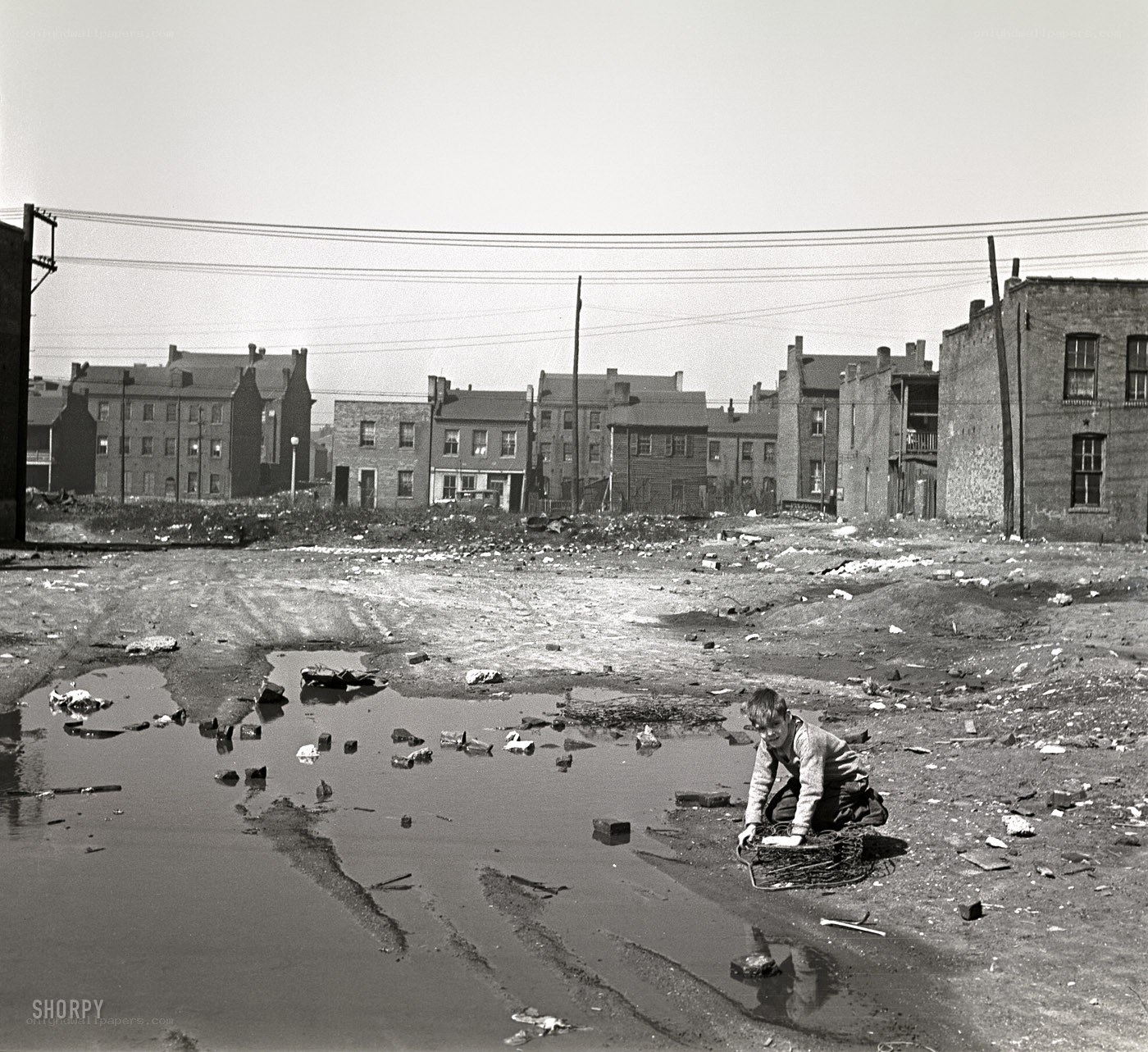 Boy in a vacant lot