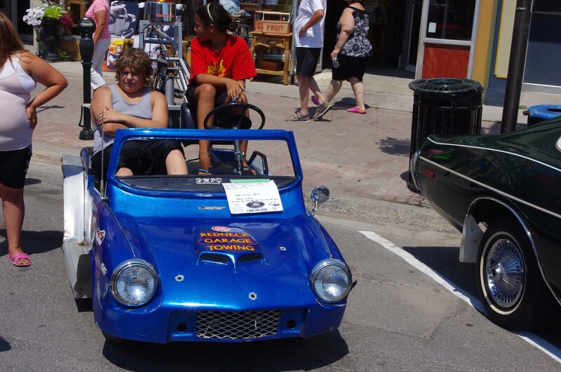 Boy in Blue Toy Car