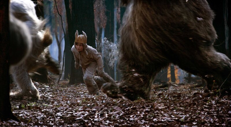 Boy in forest with creatures