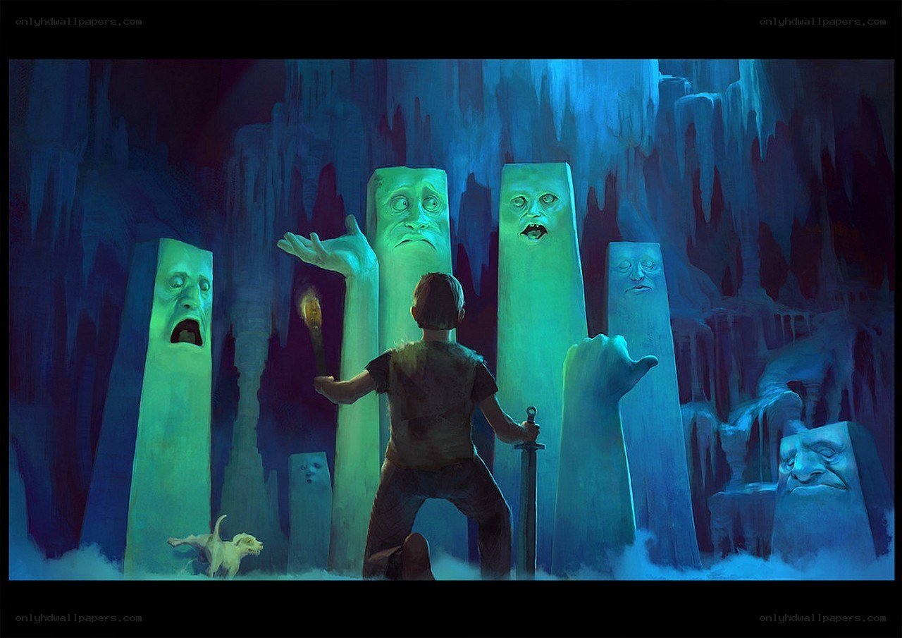 boy in icy cave with stone faces