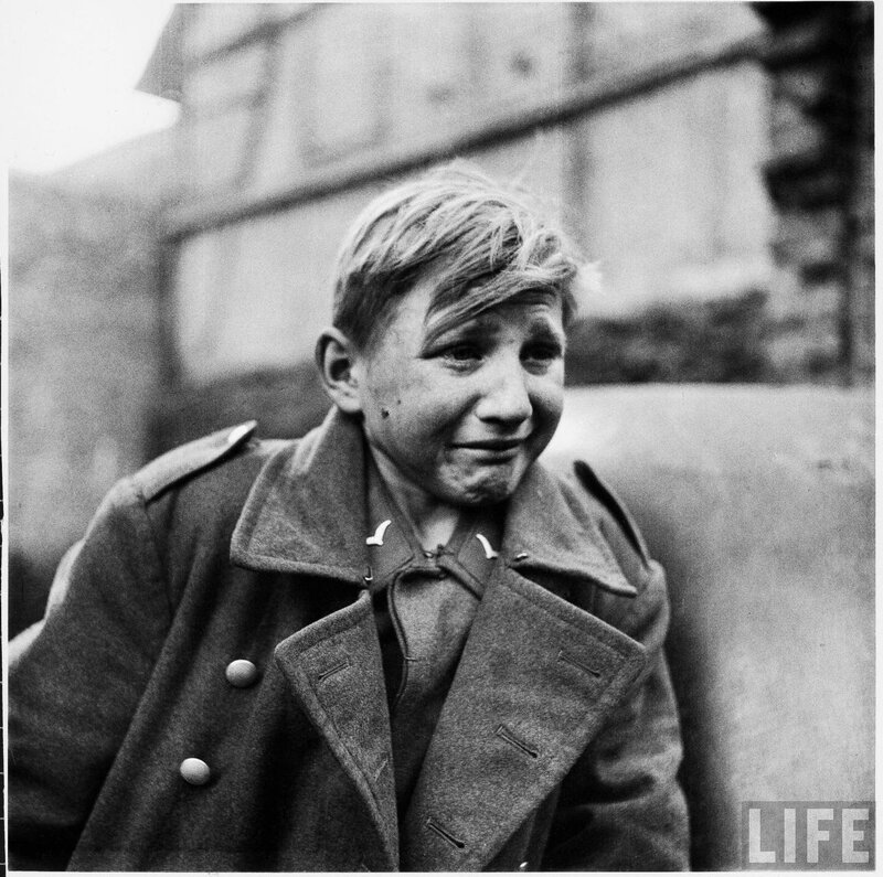 Boy in military coat