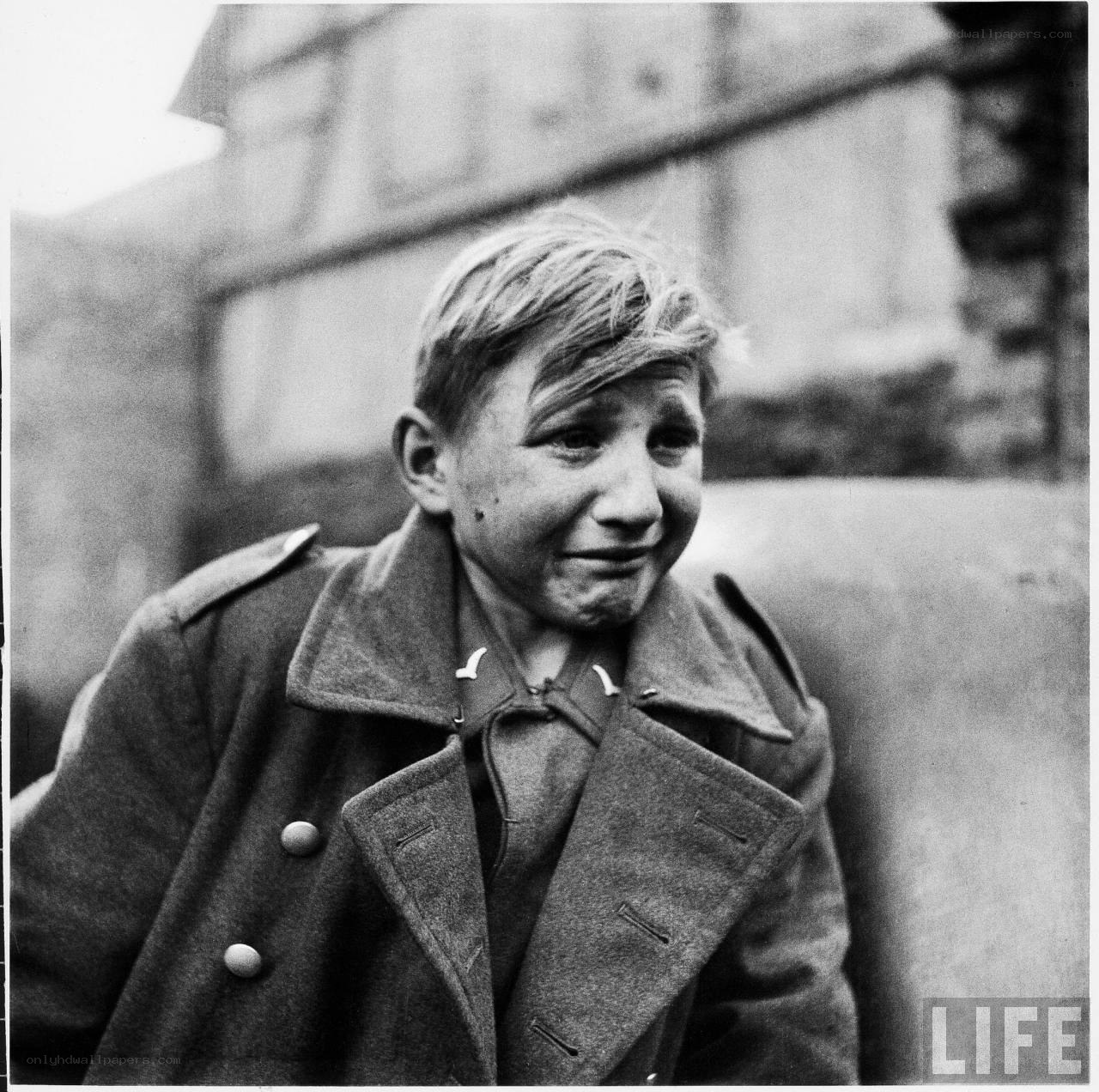 Boy in military coat