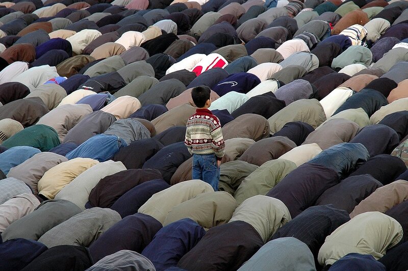 Boy in Prayer Crowd