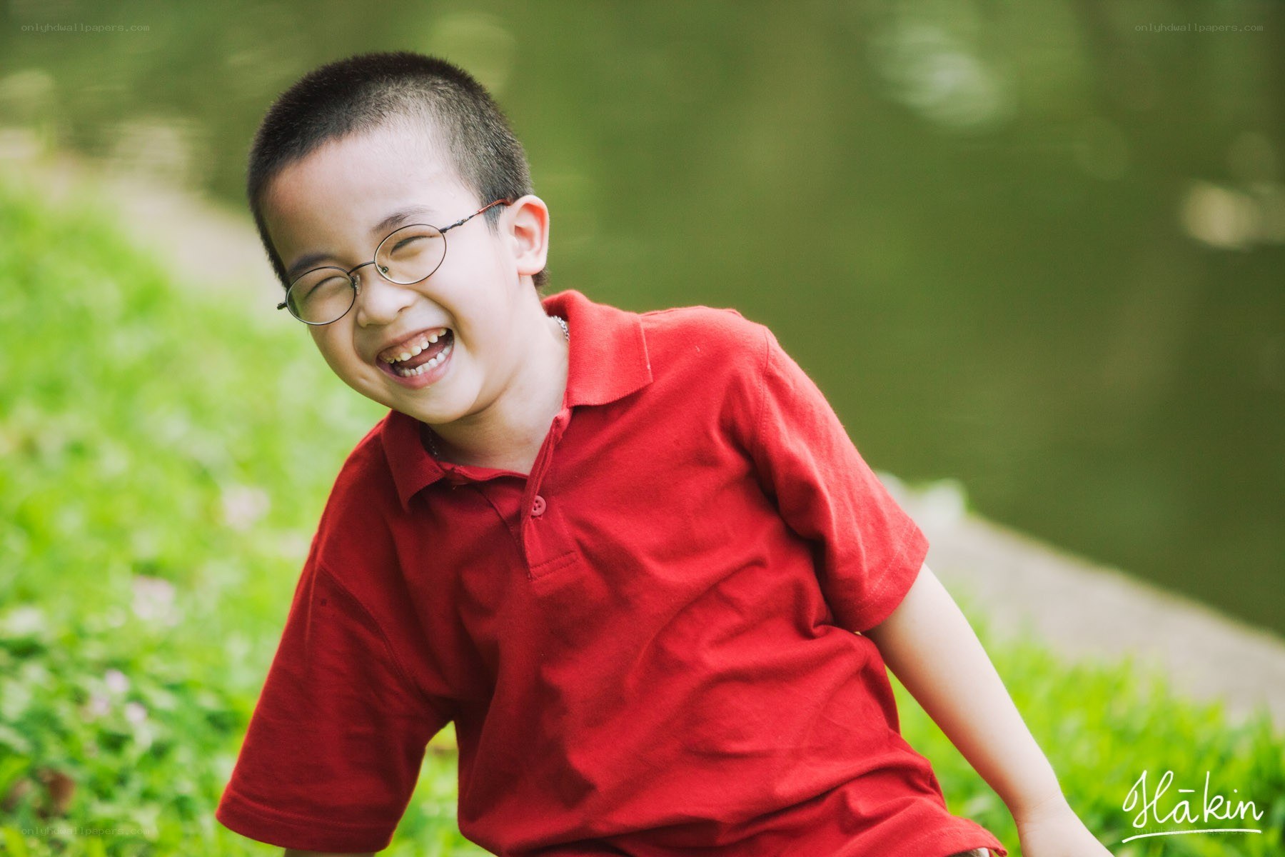 Boy in red shirt laughing