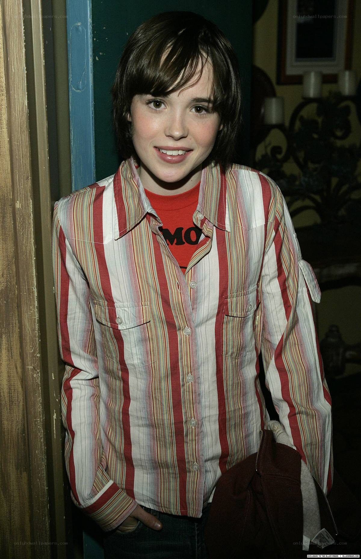 boy in striped shirt smiling