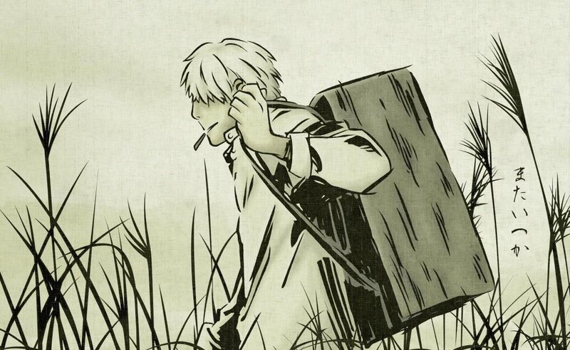 boy in tall grass with backpack